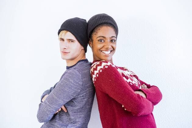Portrait of young couple back to back in front of white background model released Symbolfoto  SIPF01303