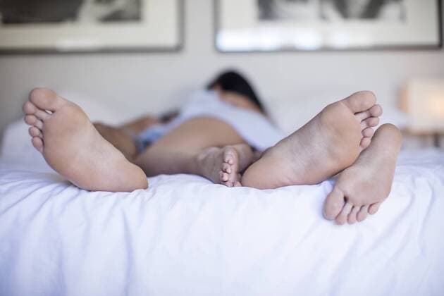 Feet of couple having sex in bed model released Symbolfoto property released  ZEF12180