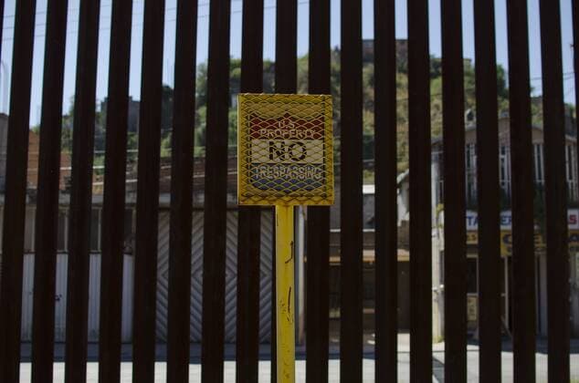 January 25, 2107 - File - President Trump signed executive orders to begin the construction of a wall on the US-Mexico border, boosting border patrol forces and increasing the number of immigration enforcement officers who carry out deportations. Pictured: October 8, 2016 - Nogales, Arizona, U.S - A No Trespassing sign marks the U.S. Mexico border wall. Hundreds of activists converged in Arizona and Nogales, Sonora (Mexico) to take part in the School of the Americas Watch Border Encuentro. Among other issues, demonstrators denounced U.S. military and economic intervention in the Americas, as well as the militarization of the border and the criminalization of migration. Nogales U.S. - ZUMAh126 20170125_sho_h126_109 Copyright: xGrahamxCharlesxHuntx