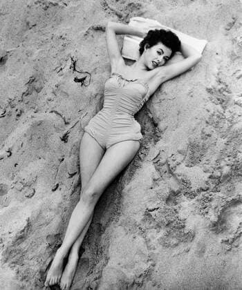 Actress Rita Moreno, Portrait in Bathing Suit on Beach, circa mid-1950 s - ZUMAg145 20060223_zap_g145_022 Copyright: xJTxVintagex