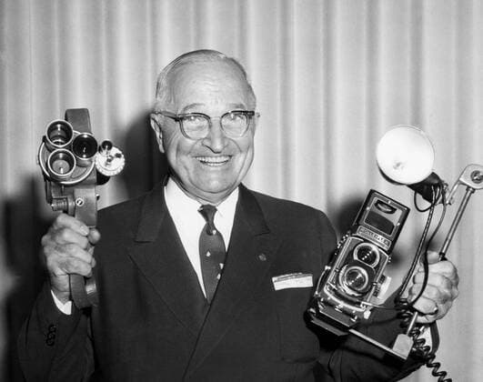 March 21, 2006 - Former U.S. President Harry S. Truman, Smiling Portrait Holding Two Cameras, June 1960 - ZUMAg145 20060321_zap_g145_1204 Copyright: xJTxVintagex