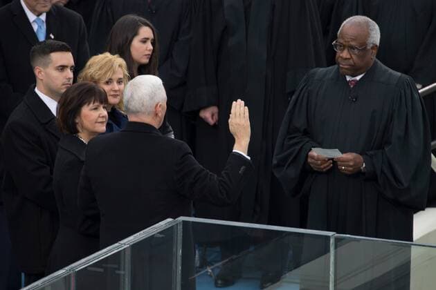 January 20, 2017 - Washington, United States - U.S. Vice President Mike Pence raises his hand as he takes the oath of office from Supreme Court Justice Clarence Thomas during the 58th Presidential Inauguration at the U.S. Capitol Building January 20, 2017 in Washington, DC. Washington United States - ZUMAp138 20170120_zaa_p138_064 Copyright: xCristianxL.xRicardox