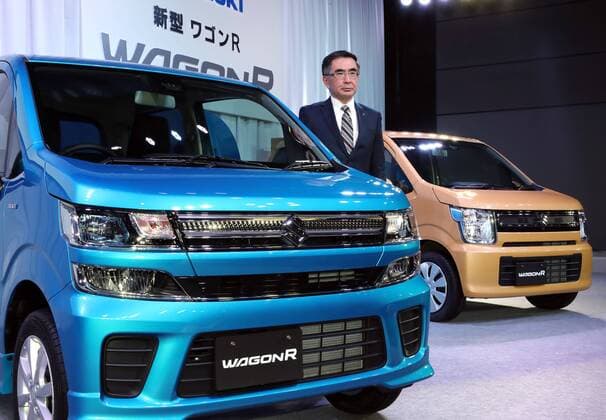 February 1, 2017, Tokyo, Japan - Japan s minicar maker Suzuki Motor president Toshihiro Suzuki displays the mini wagon Wagon R which has 660cc engine or engine electric-motor hybrid system to drive roomy body in Tokyo on February 1, 2017. The new Wagon R has various safety devices and minicar s first head-up display.  (lwxa007946)