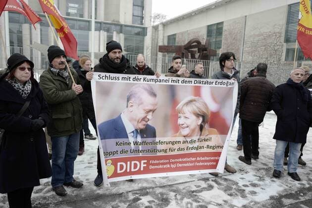 February 1, 2017 - Berlin, Berlin, Germany - HAKAN TAS, member of the berlin state parliament, together with a group of protesters, organized by the Foederation der Demokratischen Arbeitervereine (turkish: Demokratik Isci Dernekleri Federasyonu, DIDF), in front of the Federal Chancellery in order to protest the German chancellor Mrs. Angela Merkel who is visiting Turkey. The protestors criticize Merkel for her controversial policy on the refugee crisis and particularly the deal of the EU with Turkey. Berlin Germany - ZUMAs172 20170201_zap_s172_006 Copyright: xJanxScheunertx