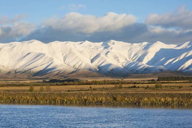 The Ben Ohau Range cloaked in autumn snow, the Pukaki Canal in foreground, Twizel, Mackenzie district, Canterbury, South Island, New Zealand, Pacific Copyright: RuthxTomlinson 390-2979