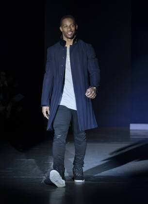 USA: The Blue Jacket Fashion Show Victor Cruz in John Varvatos dress walks runway for the blue jacket fashon show in support for prostate cancer awarness during New York Fashion week at Pier 59  LevxRadin