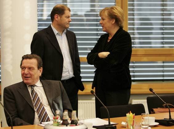Nov 10, 2005 - Berlin, GERMANY - After the inconclusive result of the 2005 German federal election, neither of the traditional coalitions could form a majority government and so the formation of a new government required careful negotiations. Finally, on October 10, officials from the CDU CSU and the SPD announced that negotiations had concluded successfully on forming a Grand Coalition with Angela Merkel as a Chancellor. Detailed negotiations on the formation of the new government continued into November. PICTURED: Chancellor GERHARD SCHROEDER, SPD politician OLAF SCHOLZ and Designated Chancellor and CDU CSU Chairwoman ANGELA MERKEL. - ZUMAkg1_ 20051110_olc_k98_815 Copyright: xKEYSTONEx