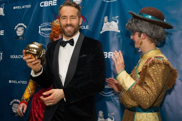 Actor Ryan Reynolds (C) poses with his Pudding Pot trophy with Harvard students Dylan Peterson (L) and Dan Milaschewski in costume, after Reynolds was awarded the Harvard University Hasty Pudding Theatricals 2017 Man of the Year inside Farkas Hall in Cambridge, Massachusetts on February 3, 2017.  BOS20170203009 MATTHEWxHEALEY