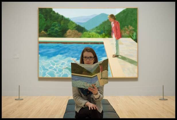 . 06 02 2017. London, United Kingdom. A Gallery assistant sits in front of the David Hockney artwork called Portrait of an Artist (Pool with two figures) 1972. David Hockney Press Preview at Tate Britain, London, UK.  xBenxStevensx xi-Imagesx IIM-14328-0002