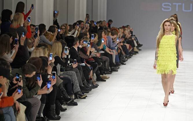 February 8, 2017 - Kiev, Ukraine - Visitors take photo of models as they present creations by Ukrainian brand Yanina Studio, during the Ukrainian Fashion Week in Kiev, Ukraine, on 08 February 2017. The fashion event presents Fall Winter 2017 18 collections by Ukrainian and International designers from 4 to 8 February. Kiev Ukraine - ZUMAg194 20170208_zap_g194_030 Copyright: xSergxGlovnyx
