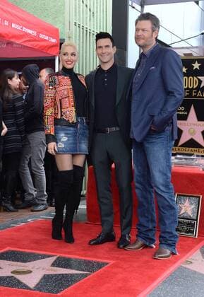 Singer and songwriter Adam Levine (C) is joined by singers Gwen Stefani and Blake Shelton during a ceremony honoring him with the 2,061st star on the Hollywood Walk of Fame in Los Angeles on February 10, 2017.  LAP2017021012 JIMxRUYMEN