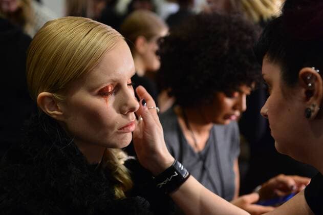 A model gets her makeup done backstage just before the Christian Siriano fashion show at New York Fashion Week: The Plaza Hotel on February 11, 2017 in New York City.  NYP20170211865 ANDREAxHANKS