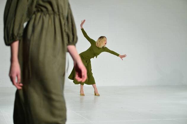 A model walks on the runway as a dancer performs at the Mara Hoffman fashion show at New York Fashion Week: The Shows at Shop Studios on February 13, 2017 in New York City.  NYP201702131038 ANDREAxHANKS