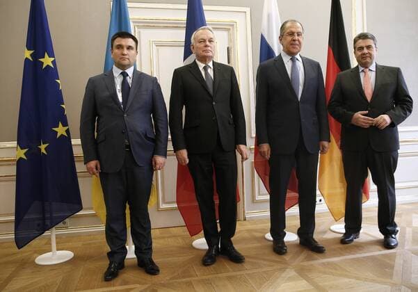 MUNICH, GERMANY - FEBRUARY 18, 2017: Ukraine s Foreign Minister Pavlo Klimkin, France s Foreign Minister Jean-Marc Ayrault, Russia s Foreign Minister Sergei Lavrov, and Germany s Foreign Minister Sigmar Gabriel (L-R) pose for a photo during a meeting to discuss ways to resolve the Ukrainian conflict on the sidelines of the the 53rd Munich Security Conference. Alexander Shcherbak TASS  TS041BFD