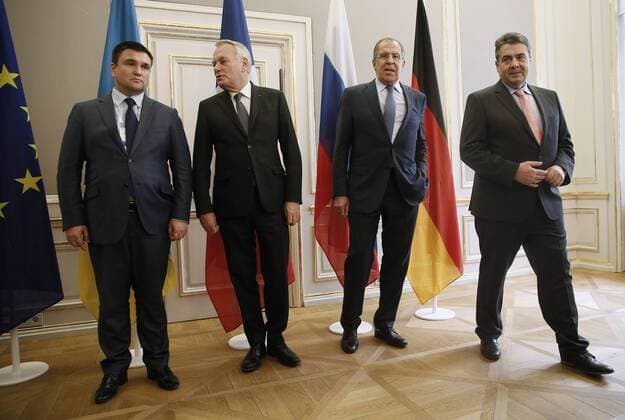 MUNICH, GERMANY - FEBRUARY 18, 2017: Ukraine s Foreign Minister Pavlo Klimkin, France s Foreign Minister Jean-Marc Ayrault, Russia s Foreign Minister Sergei Lavrov, and Germany s Foreign Minister Sigmar Gabriel (L-R) pose for a photo during a meeting to discuss ways to resolve the Ukrainian conflict on the sidelines of the 53rd Munich Security Conference. Alexander Shcherbak TASS  TS041C05
