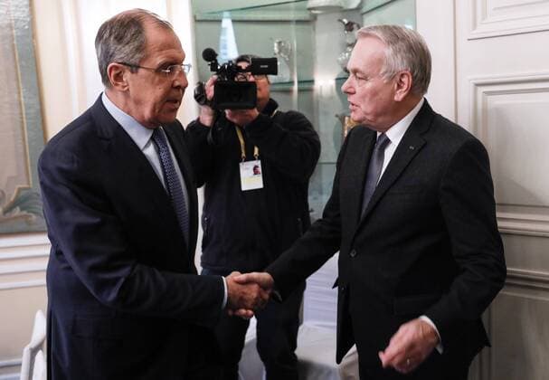 MUNICH, GERMANY - FEBRUARY 18, 2017: Russia s Foreign Minister Sergei Lavrov (L) and France s Foreign Minister Jean-Marc Ayrault shake hands as they meet on the sidelines of the 53rd Munich Security Conference. Alexander Shcherbak TASS  TS041C43
