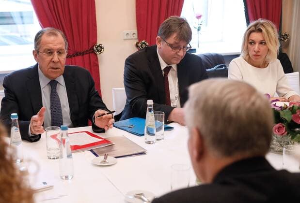 MUNICH, GERMANY - FEBRUARY 18, 2017: Russia s Foreign Minister Sergei Lavrov (L) and France s Foreign Minister Jean-Marc Ayrault (front) meet on the sidelines of the 53rd Munich Security Conference. Pictured R background is Russian Foreign Ministry spokesperson Maria Zakharova. Alexander Shcherbak TASS  TS041C45