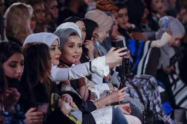 February 18, 2017 - London, UK - London, UK. Members of the audience await the first catwalk of the day at the UK s first London Modest Fashion Week taking place this weekend at the Saatchi Gallery. The two day event sees 40 brands from across the world come together to showcase their collections for Muslim and other religious women. London UK  - ZUMAl94_ 20170218_zaf_l94_023 Copyright: xStephenxChungx