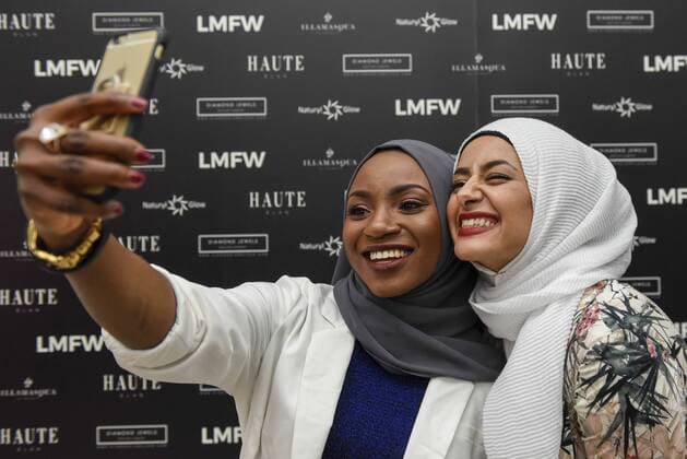 February 18, 2017 - London, UK - London, UK. Visitors take a selfie at the UK s first London Modest Fashion Week taking place this weekend at the Saatchi Gallery. The two day event sees 40 brands from across the world come together to showcase their collections for Muslim and other religious women. London UK  - ZUMAl94_ 20170218_zaf_l94_027 Copyright: xStephenxChungx