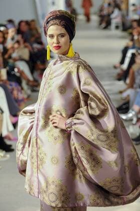 February 18, 2017 - London, UK - London, UK. A model presents a look by Tuhfah (Malaysia) at the UK s first London Modest Fashion Week taking place this weekend at the Saatchi Gallery. The two day event sees 40 brands from across the world come together to showcase their collections for Muslim and other religious women. London UK  - ZUMAl94_ 20170218_zaf_l94_039 Copyright: xStephenxChungx