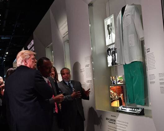 President Donald Trump looks at the Ben Carson exhibit as he visits the Smithsonian National Museum of African American History and Culture in Washington, DC on February 21, 2017.  WAP2017022103 KEVINxDIETSCH