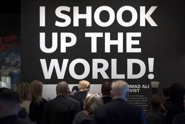 February 21, 2017 - Washington, District of Columbia, United States of America - United States President Donald Trump (C) walks under a quote by Muhammad Alias he tours the Smithsonian National Museum of African American History & Culture in Washington, D.C. on February 21, 2017. Photo Credit: CNP AdMedia Washington United States of America - ZUMAa123 20170221_zaa_a123_026 Copyright: xKevinxDietschx