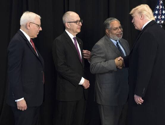 February 21, 2017 - Washington, District of Columbia, United States of America - United States President Donald Trump shakes hands with Lonnie Bunch, founding Director of the Smithsonian National Museum of African American History & Culture, as Smithsonian Director David Skorton (C) and Philanthropist David Rubenstein wait to greet him, after Trump toured the museum in Washington, D.C. on February 21, 2017. Photo Credit: CNP AdMedia Washington United States of America - ZUMAa123 20170221_zaa_a123_027 Copyright: xKevinxDietschx