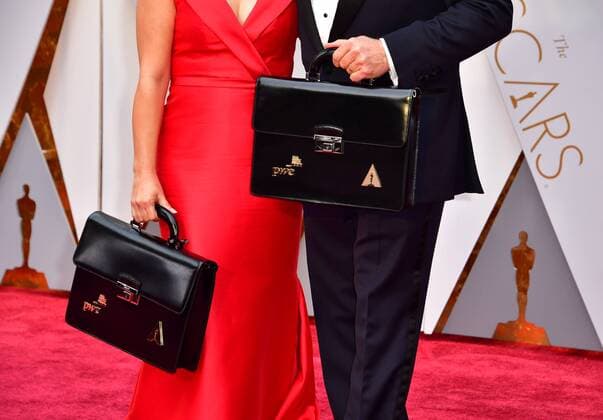 The team from Price Waterhouse Cooper, Martha Ruiz and Brian Cullinan, arrive with the Oscar voting results on the red carpet for the 89th annual Academy Awards at the Dolby Theatre in the Hollywood section of Los Angeles on February 26, 2017.  LAP2017022676 KEVINxDIETSCH