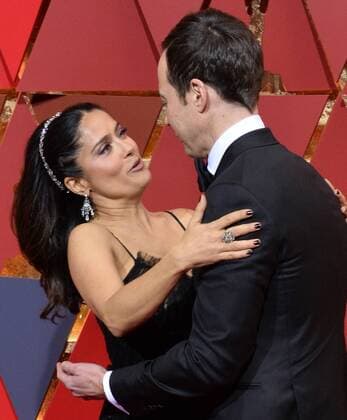 Actress Salma Hayek greets Jim Parsons on the red carpet for the 89th annual Academy Awards at the Dolby Theatre in the Hollywood section of Los Angeles on February 26, 2017.  LAP20170226032 JIMxRUYMEN
