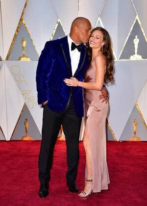 Actor Dwayne The Rock Johnson (L) and Lauren Hashian arrive on the red carpet for the 89th annual Academy Awards at the Dolby Theatre in the Hollywood section of Los Angeles on February 26, 2017.  LAP2017022732 KEVINxDIETSCH
