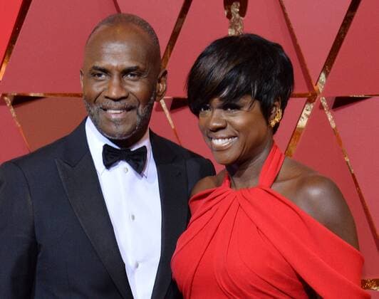 Actors Viola Davis (R) and Julius Harris arrive on the red carpet for the 89th annual Academy Awards at the Dolby Theatre in the Hollywood section of Los Angeles on February 26, 2017.  LAP20170226831 JIMxRUYMEN