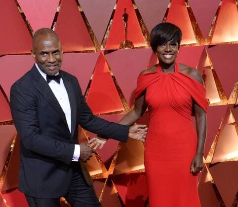 Actors Viola Davis (R) and Julius Harris arrive on the red carpet for the 89th annual Academy Awards at the Dolby Theatre in the Hollywood section of Los Angeles on February 26, 2017.  LAP20170226829 JIMxRUYMEN