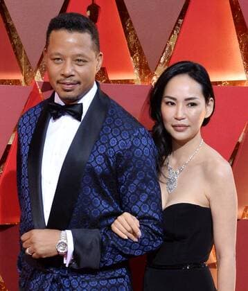 Actor Terrence Howard (L) and Mira Pak arrive on the red carpet for the 89th annual Academy Awards at the Dolby Theatre in the Hollywood section of Los Angeles on February 26, 2017.  LAP20170226880 JIMxRUYMEN