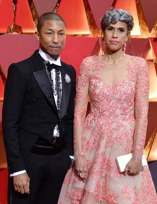 Musician Pharrell Williams (L) and producer Mimi Valdez arrive on the red carpet for the 89th annual Academy Awards at the Dolby Theatre in the Hollywood section of Los Angeles on February 26, 2017.  LAP20170226080 JIMxRUYMEN