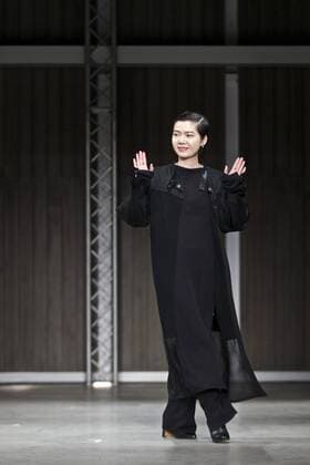 Chinese designer Rico acknowledges the applause after RICOSTRU show during Milan Fashion Week Fall Winter 2017 2018 on Feb. 27, 2017, in Milan, Italy. ) ITALY-MILAN-FASHION WEEK-RICOSTRU JinxYu 
