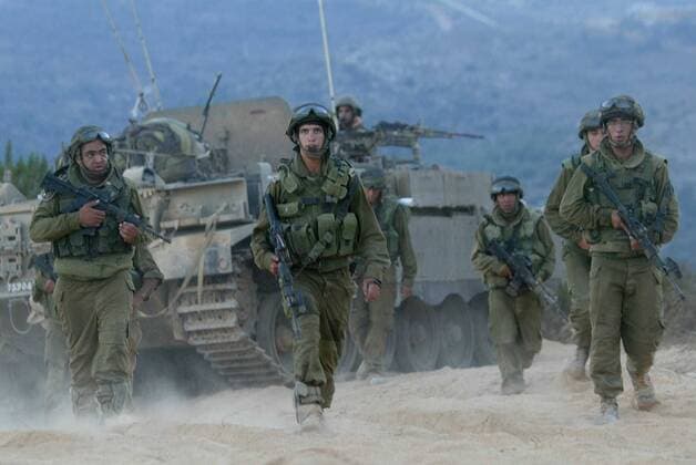 Aug. 8, 2006 - U.S. - Israeli soldiers patrol near the Israeli-Lebanese border, August 8, 2006. Israel stood poised to widen its military operation to end Hezbollah rocket fire on northern Israel today as the U.N. Security Council heard proposals from Arab League diplomats for changes to a cease-fire resolution. Israeli Prime Minister Ehud Olmert said his Cabinet would consider expanding the ground war Wednesday and Israeli commentators suggested that military preparations were quickly reaching the point of no return. ( Flash90 MCT) - ZUMAm67_ 20060808_baf_m67_035 Copyright: xPierrexTjerdmanx