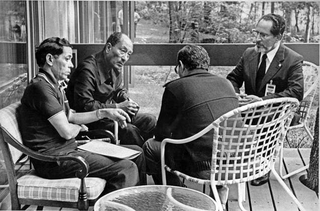 Jan. 6, 2011 - Thurmont, Maryland, United States of America - President Anwar Sadat of Egypt, center left, confers with Foreign Minister Muhammad Ibrahim Kamal of Egypt, right, Deputy Premier Hassan Tohami of Egypt, right center, and Osama Al Baz, Ambassador of Egypt to the U.S., left, at Camp David, near Thurmont, Maryland on Tuesday, September 12, 1978.. - ZUMAs152 20110106_zaa_s152_007 Copyright: xWhitexHousex