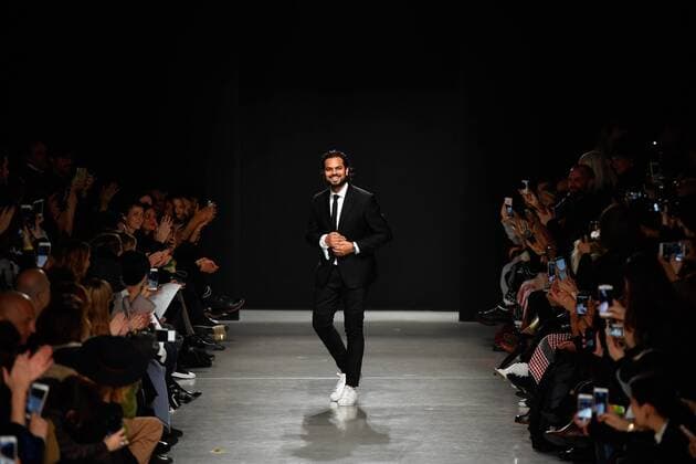 (170304) -- PARIS, March 4, 2017 -- Indian fashion designer Rahul Mishra greets the audience during the Women s Ready-to-Wear Fall Winter 2017 2018 fashion week in Paris, France, on March 4, 2017. ) FRANCE-PARIS-FASHION WEEK-RAHUL MISHRA ChenxYichen 