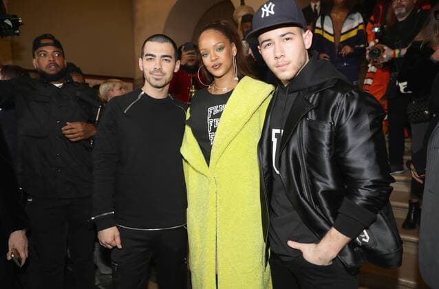 216127 Fenty x Puma Starface 2017-03-06 Paris France Paris Fashion Week. Defile PAP Automne-hiver 2017. FENTY x PUMA by Rihanna. PARIS, FRANCE - MARCH 06: Joe Joans, Rihanna and Nick Jonas pose backstage after FENTY PUMA by Rihanna Fall Winter 2017 Collection at Bibliotheque Nationale de France on March 6, 2017 in Paris, France. (Photo by Vittorio Zunino Celotto Getty Images for Fenty Puma ) Local Caption Joe Jonas; Rihanna; Nick Jonas Fenty, Robyn Rihanna ( Rihanna ); Jonas, Nick; Jonas, Joe  Copyright: xFentyxxxPumax xStarfacex STAR_216127_009