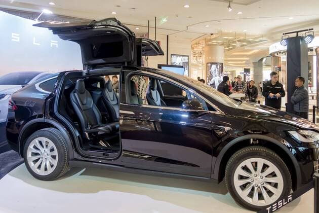 March 9, 2017 - Shanghai, Shanghai, China - Shanghai, CHINA-March 9 2017: (EDITORIAL USE ONLY. CHINA OUT)..A black Tesla Model X shows at a shopping mall in Shanghai, March 9th, 2017. The Tesla Model X is a full-sized, all-electric, luxury, crossover SUV made by Tesla Inc. that uses falcon wing doors for access to the second and third row seats. Shanghai China  - ZUMAs145 20170309_zaa_s145_092 Copyright: xWangxGangx