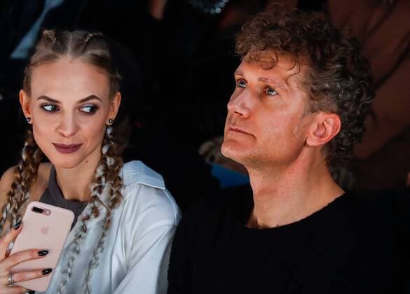 MOSCOW, RUSSIA - MARCH 12, 2017: Glavkino Group of Companies General Director Ilya Bachurin (R) and actress Nadezhda Sysoyeva watch a runway show for the Spring Summer 2017 collection by Russian fashion designer Alexandr Rogov on the opening day of the 2017 Mercedes-Benz Fashion Week Russia in the Manege Central Exhibition Hall. Artyom Geodakyan TASS  TS043FF3