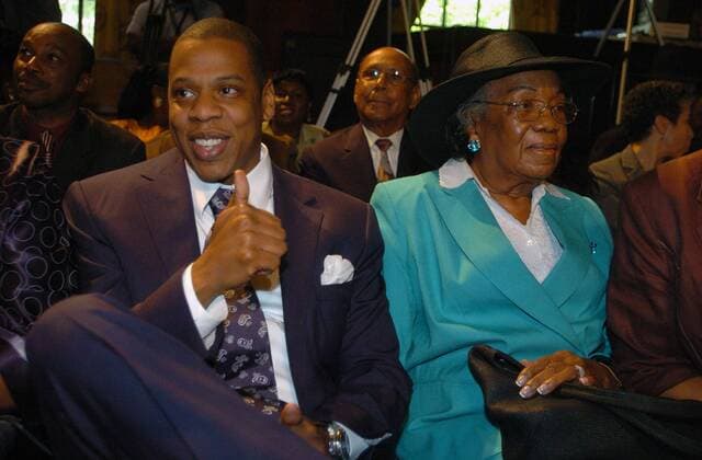 May 09, 2007 - Manhattan, NY, USA - JAY-Z (L), giving a thumbs up, seated with family in City Council Chambers. Gloria Carter, CEO of the Shawn Carter Scholarship Fund, named after her son Shawn Carter who is also known as Jay-Z, is honored by the City Council of New York for her charitable efforts. The Shawn Carter Scholarship Fund is an education focused charity that has placed over 5 dozen students in top-tier colleges and also offers mentoring and college tutoring. - ZUMAb09_ 20070509_bry_b09_016 Copyright: xBryanxSmithx