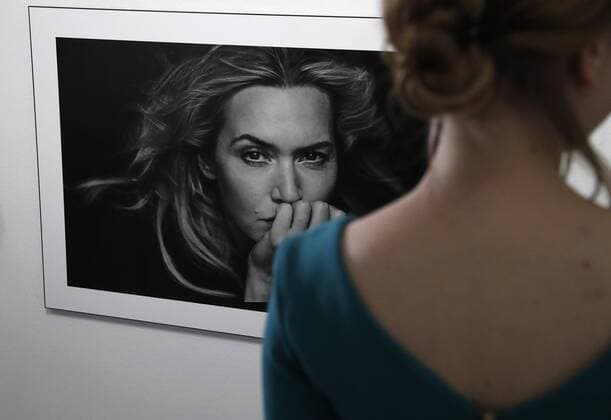 MOSCOW, RUSSIA - MARCH 16, 2017: A visitor by a photograph of actress Kate Winslet taken for the 2017 Pirelli Calendar on display at an exhibition titled Pirelli Calendar 2017 by Peter Lindbergh at Moscow s Multimedia Art Museum. The exhibition is open from March 17 to May 14, 2017. Artyom Geodakyan TASS  TS04486E