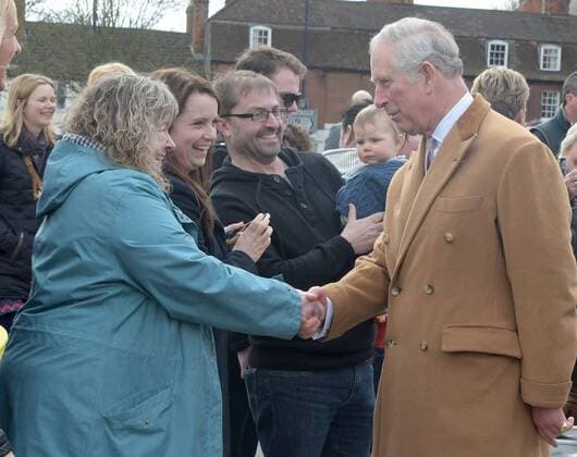 The Prince of Wales visits the Wadworth Brewery to learn more about the history of the family-owned business and tour its facilities, including the traditional sign painting shop and Shire horse stables in Wiltshire. The Prince of Wales shakes hands with members of the community and the Wadworth Brewery in Devizes, Wiltshire. MARCH 17th 2017  RWNx17581