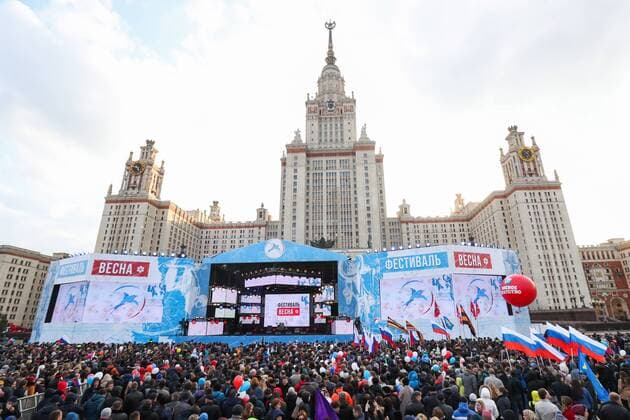 MOSCOW, RUSSIA - MARCH 18, 2017: People attend a concert marking the 3rd anniversary of Crimea s reunification with Russia, by the Moscow State University main building. Vyacheslav Prokofyev TASS  TS044B71