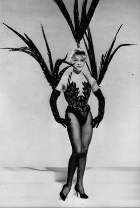 Feb. 02, 1959 - This is Line Renaud: Line Renaud, the famous French music music hall and Radio Singer, will be starring the new show at the Casino De Paris. Photo Shows: Line Renaud as she appear in the new show Black Mittens with sequens and Pheasant father all over. - ZUMAk09_ 19590202_baf_k09_219 Copyright: xKeystonexPressxAgencyx