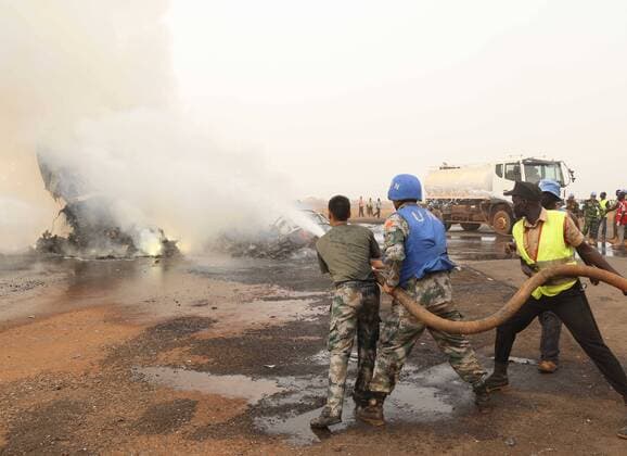 (170321) -- WAU (SOUTH SUDAN), March 21, 2017 () -- Chinese peacekeepers participate in rescue work in Wau Airport, South Sudan, on March 20, 2017. All 43 passengers and six crew members have survived the plane crash that occurred in the northern South Sudan town of Wau on Monday afternoon, local authorities have confirmed. The airport is near the location of Chinese peacekeepers at Wau. After the accident, the Chinese peacekeepers hurried to the spot to help rescue people and put out the fire with water trucks. ( Liu Junhao) (zjy) SOUTH SUDAN-WAU-PLANE-CRASH Xinhua 