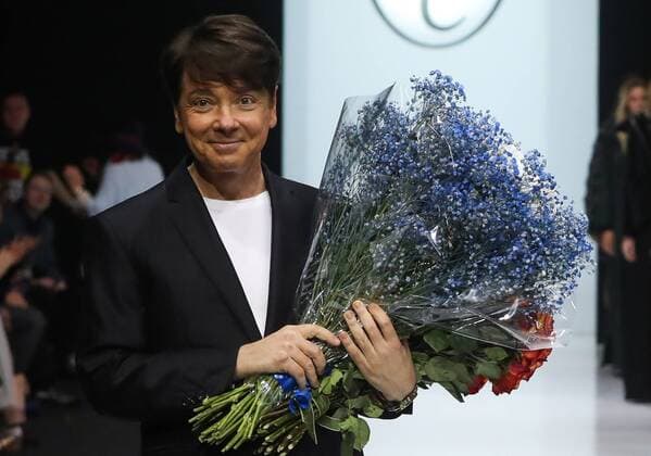 MOSCOW, RUSSIA - MARCH 21, 2017: Russian fashion designer Valentin Yudashkin receives flowers after a runway show for his Fall Winter 2017 collection titled Faberlic at the 37th Moscow Fashion Week at Moscow s Gostiny Dvor Shopping and Exhibition Centre. Stanislav Krasilnikov TASS  TS045043