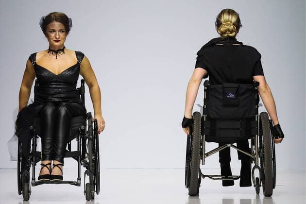 MOSCOW, RUSSIA - MARCH 23, 2017: Models in wheelchairs showcase creations during a catwalk show for the NP Open World collection at the Moscow Fashion Week, at the Gostiny Dvor Shopping and Exhibition Centre. Open World is a non-profit partnership helping integrate people with disabilities. Vyacheslav Prokofyev TASS  TS045349