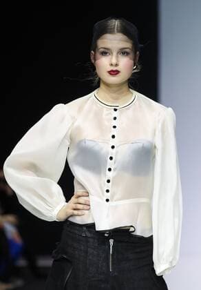 MOSCOW, RUSSIA - MARCH 23, 2017: A model showcases a creation during a catwalk show for the NP Open World collection at the Moscow Fashion Week, at the Gostiny Dvor Shopping and Exhibition Centre. Open World is a non-profit partnership helping integrate people with disabilities. Vyacheslav Prokofyev TASS  TS04534D